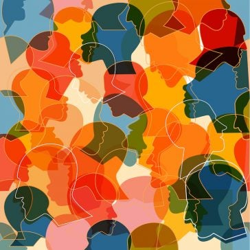 Graphic: Colorful seamless pattern of a crowd of many different people profile heads. 